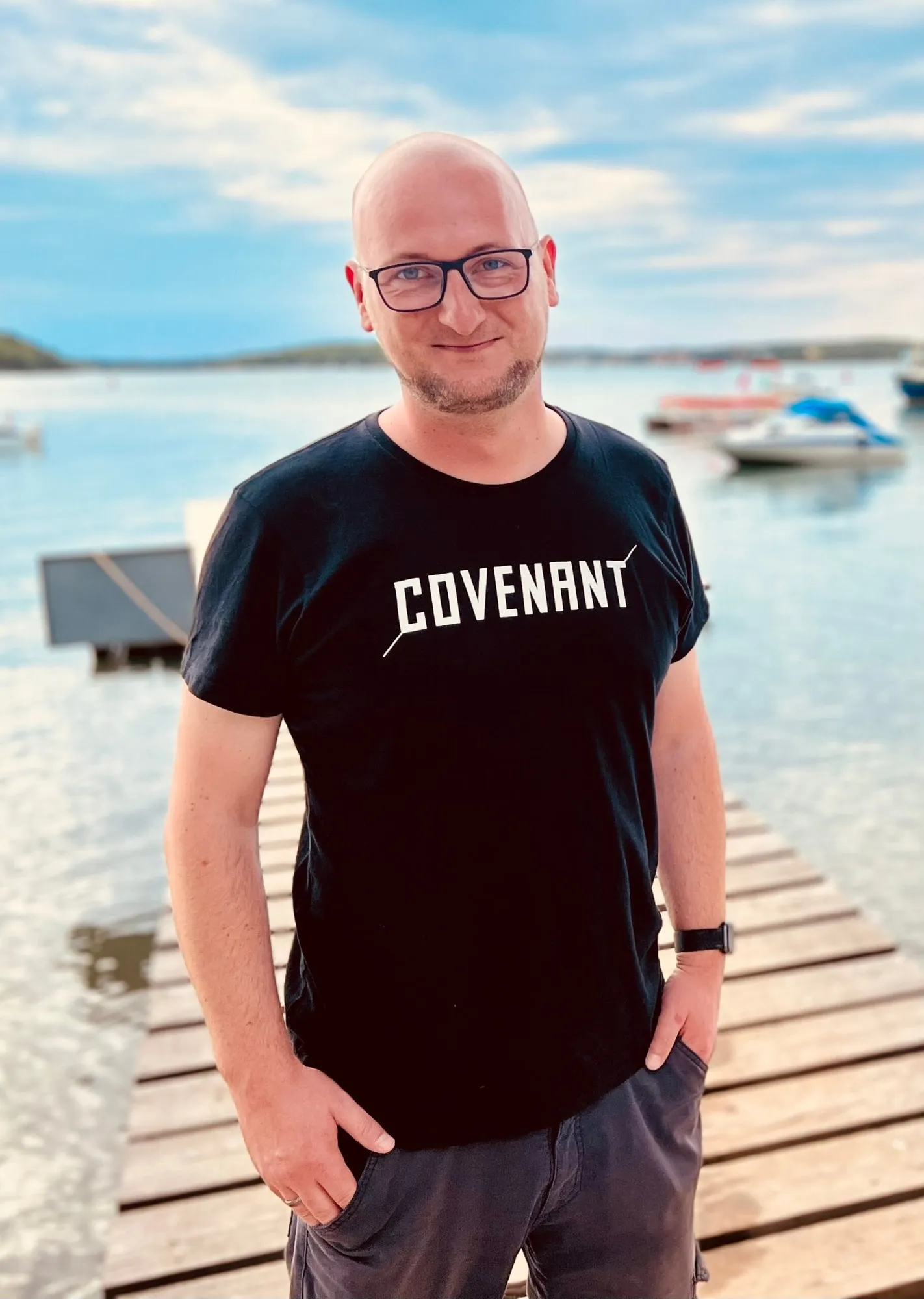 Christoph Vollmann on a jetty by a lake